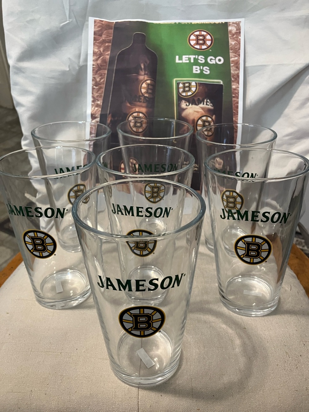 New. Set of 7 pint size glasses with Jameson - Boston Bruins logo on front